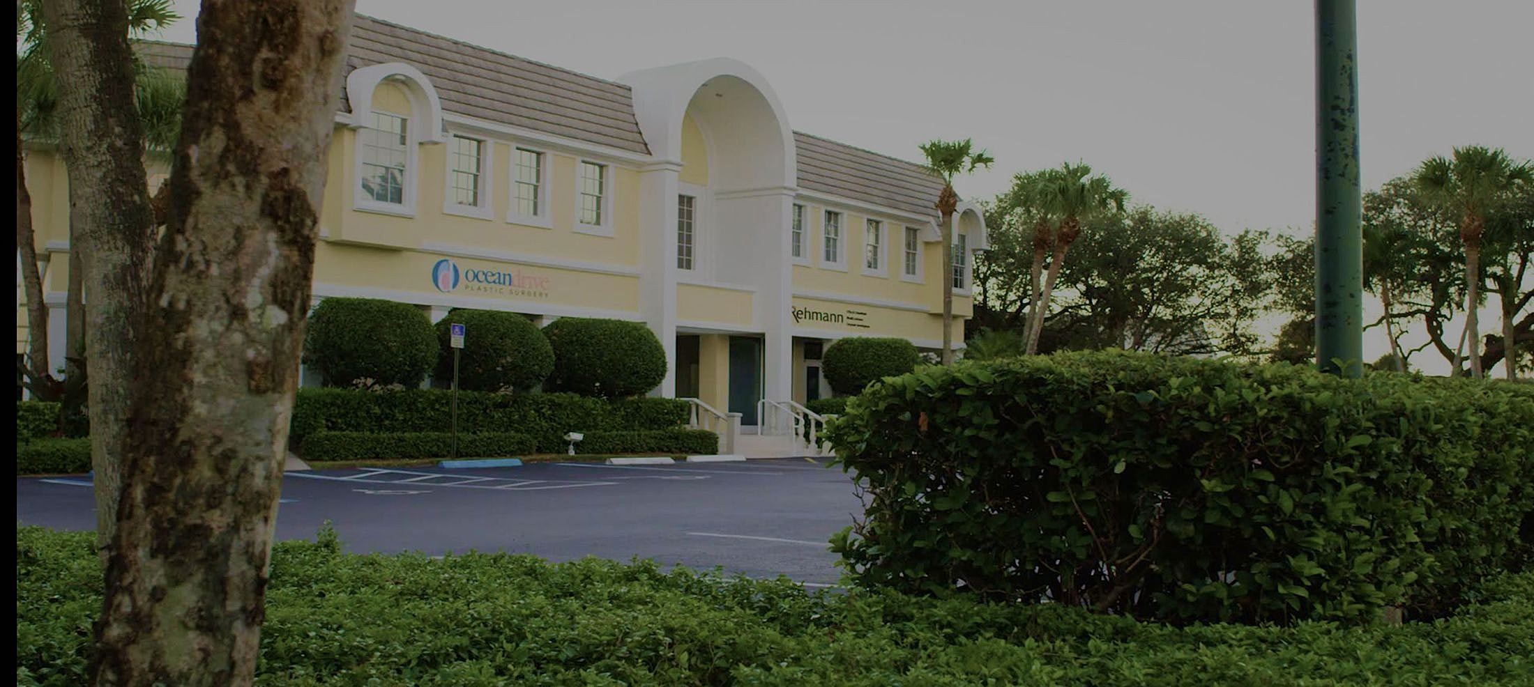 Plastic surgery clinic with landscaped surroundings.