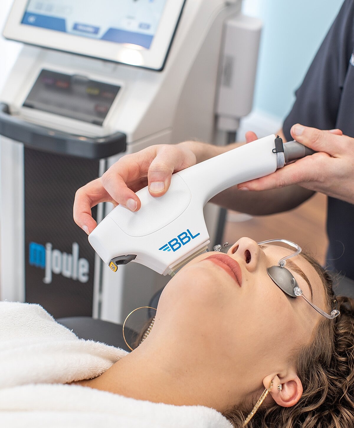 Smiling woman with long, light brown hair.