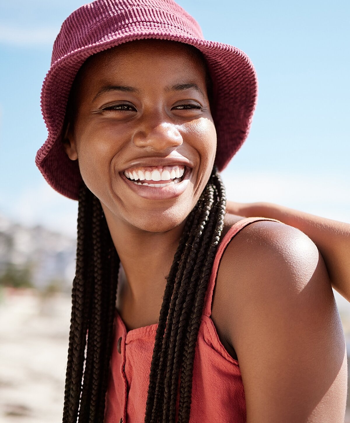 Smiling woman with long, light brown hair.