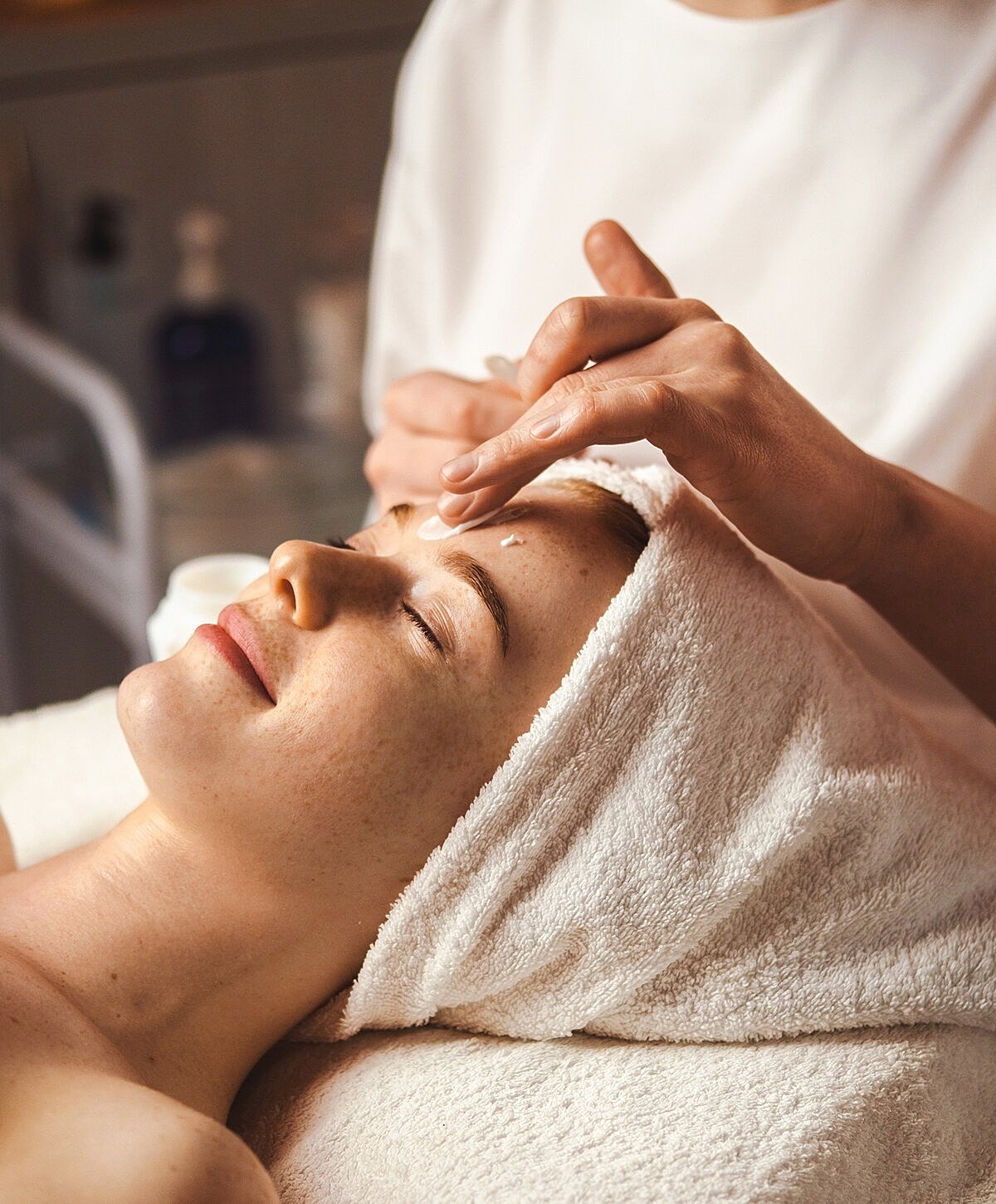 Smiling woman with long, light brown hair.